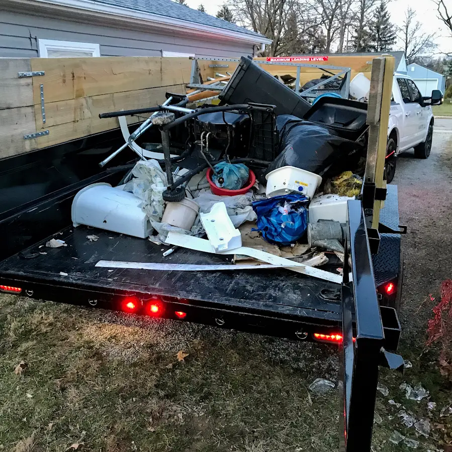 Roll-off dumpster delivered to a residential driveway in Muskegon